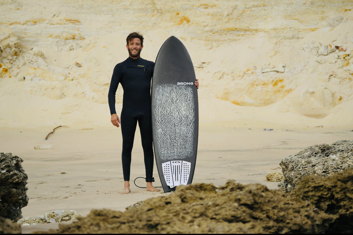 Stand-up paddleboarding on calm turquoise Dakhla lagoon waters at sunset, a relaxing alternative to kitesurfing